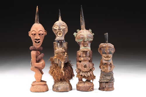 Lot 149 - A group of four Songye power figures, Nkisi,...