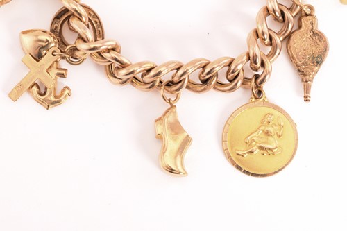 Lot 72 - A 9ct gold charm bracelet, consisting of a...