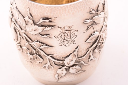 Lot 271 - An Edwardian silver christening mug, decorated...