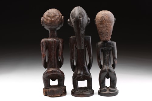 Lot 7 - Two Tabwa standing female figures and a male...