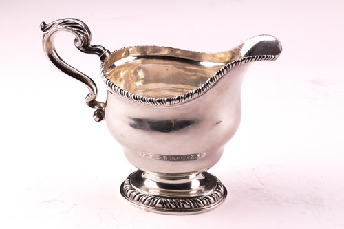Lot 283 - A pair of George II silver sauce boats, with...