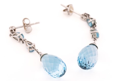 Lot 64 - A pair of blue topaz drop earrings in 9ct...