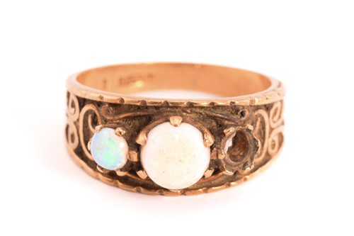 Lot 128 - Two 9ct gold gem-set rings and a white agate...