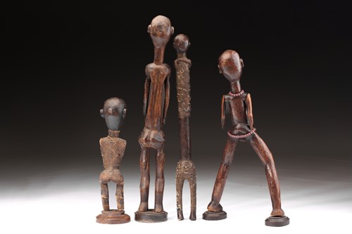 Lot 37 - A group of four Tanzanian standing figures,...