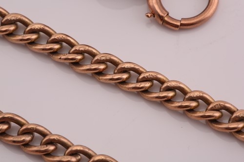 Lot 224 - A 9ct rose gold Albert chain with T bar,...