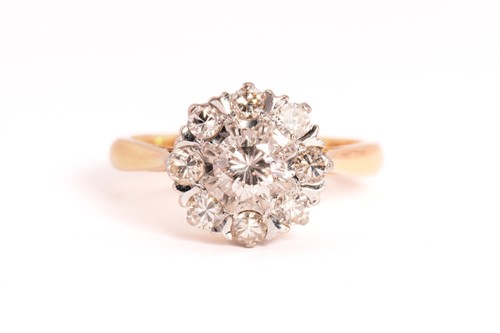 Lot 144 - A diamond cluster ring, featuring nine...