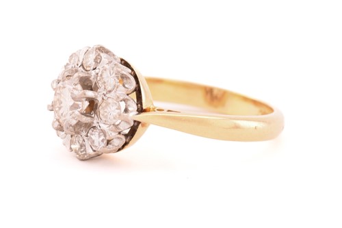 Lot 144 - A diamond cluster ring, featuring nine...