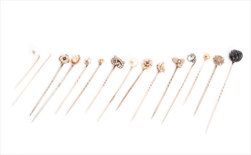 Lot 638 - A collection of fifteen stick pins of various...