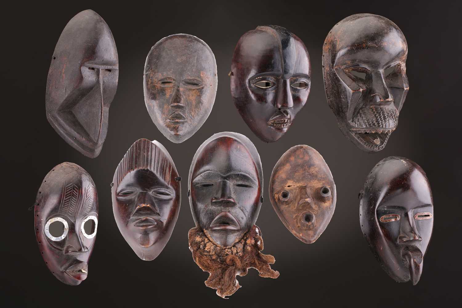 Lot 65 - A group of nine Dan masks, Liberia, to include...