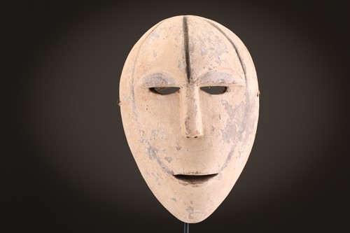 Lot 21 - A Mbole/Yela kela mask, with recessed eye...