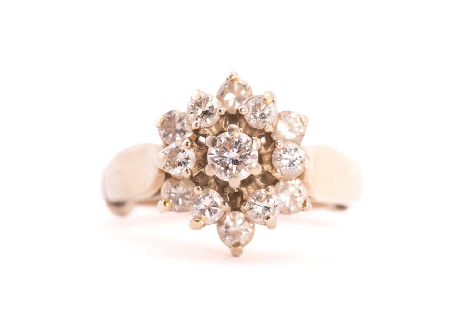 Tier Shape Diamond Rings Lot 57 - A three-tier diamond cluster ring, consisting
