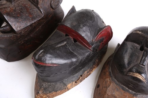 Lot 38 - A collection of zoomorphic masks, to include...