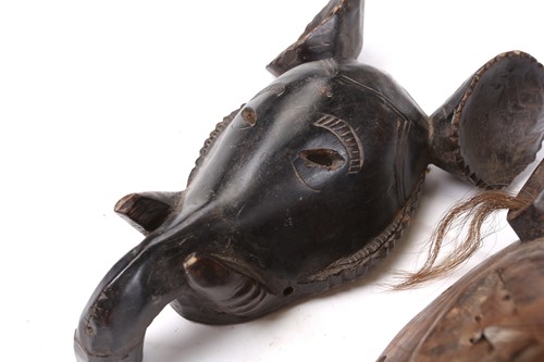 Lot 38 - A collection of zoomorphic masks, to include...