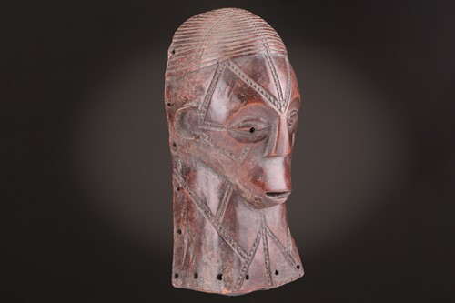 Lot 115 - A Tabwa mask, Tanzania, with linear coiffure,...