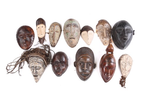 Lot 158 - A collection of twelve West African masks to...