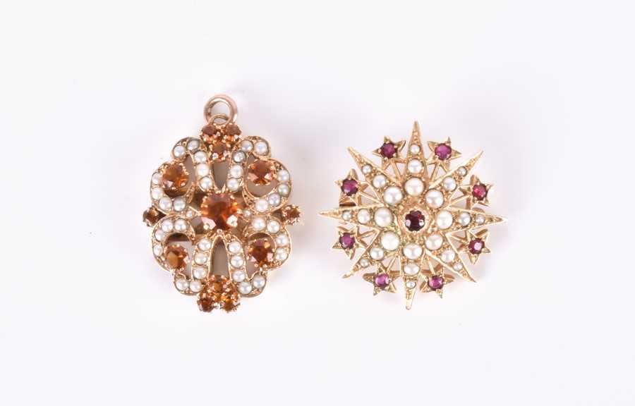 Lot 630 - A yellow metal, pearl, and ruby starburst...