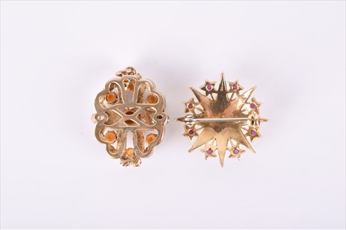 Lot 630 - A yellow metal, pearl, and ruby starburst...