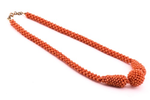Lot 122 - Three coral beaded necklaces; to include one...