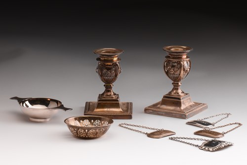 Lot 270 - A pair of dwarf silver candlesticks, the...