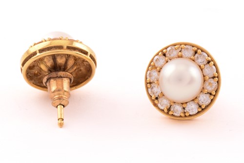 Lot 30 - A pair of pearl and diamond earrings in 18ct...
