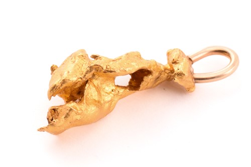 Lot 106 - A yellow metal nugget pendant, a pair of...