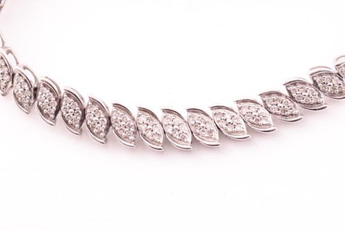 Lot 28 - A 9ct gold and diamond line bracelet, with...
