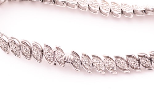 Lot 28 - A 9ct gold and diamond line bracelet, with...
