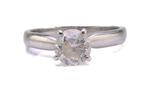 Lot 43 - A diamond solitaire ring in platinum, set with...