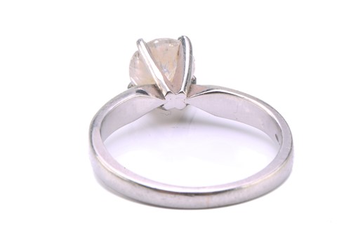 Lot 43 - A diamond solitaire ring in platinum, set with...