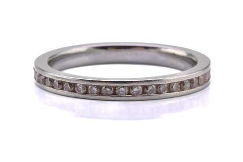Lot 153 - A diamond eternity ring, comprises an array of...