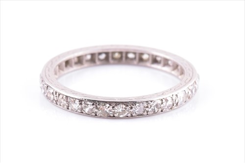 Lot 630 - A mid 20th century diamond eternity ring set...