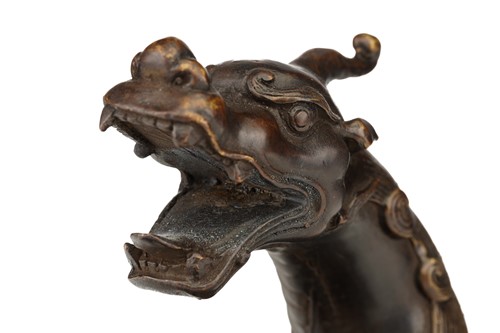Lot 106 - A Chinese bronze figure of a recumbent Pixiu,...