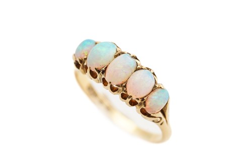 Lot 165 - A five-stone opal half hoop ring in 18ct gold,...