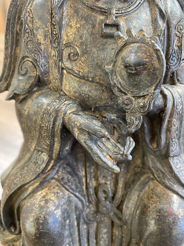 Lot 182 - A Chinese bronze figure of Guanyin, seated...