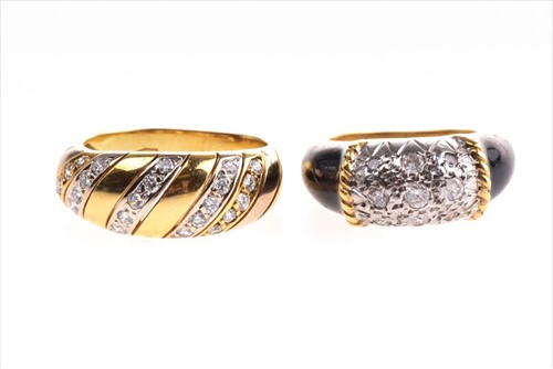 Lot 552 - A yellow metal, diamond, and black enamel...