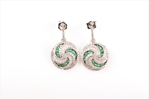 Lot 557 - A pair of diamond and emerald circular drop...