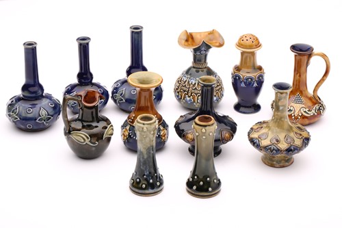 Lot 61 - Twelve Doulton stoneware miniature vases,...
