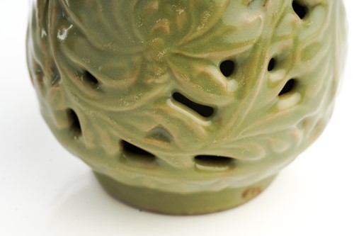 Lot 158 - A Chinese celadon double wall pierced vase,...