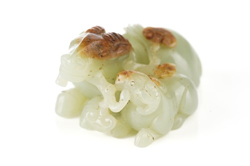 Lot 201 - A Chinese jade figure of a ram and its young,...