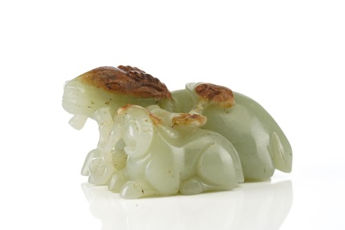 Lot 201 - A Chinese jade figure of a ram and its young,...