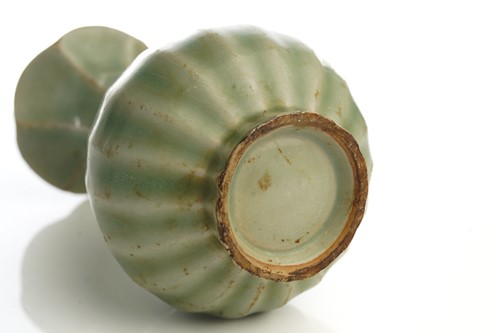Lot 159 - A Chinese celadon vase, the petal shaped...