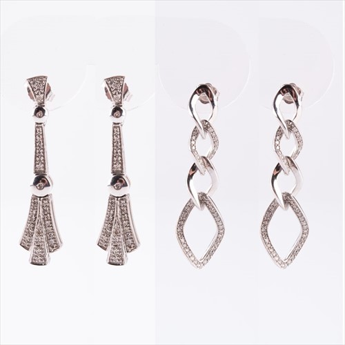 Lot 634 - A pair of 9ct white gold and diamond earrings...