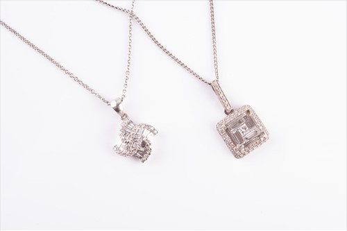 Lot 642 - Two 18 carat white gold diamond pendants one...