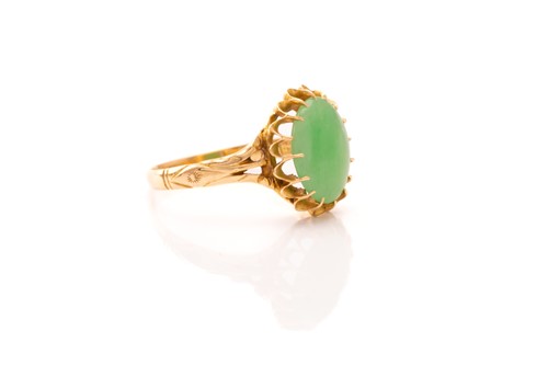 Lot 215 - A jade ring and a pair of drop earrings; the...