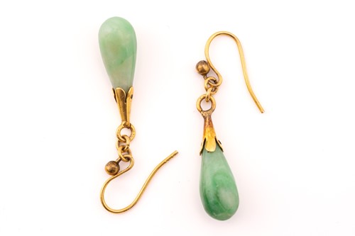 Lot 215 - A jade ring and a pair of drop earrings; the...