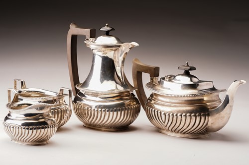 Lot 412 - A George V four-piece tea service by Thomas...