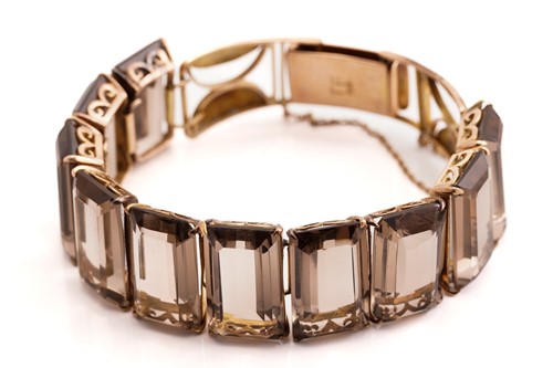Lot 139 - A smoky quartz bracelet, a brooch and matching...
