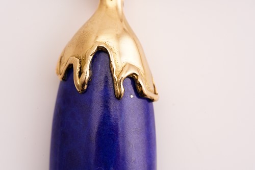Lot 265 - A lapis lazuli pendant enhancer, featuring an...