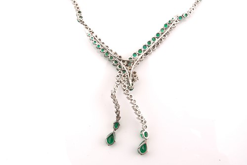 Lot 141 - An emerald and diamond necklace, of chevron...