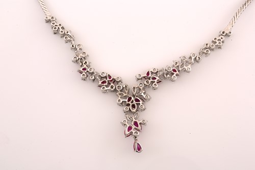 Lot 88 - A ruby and diamond necklace, claw set with...
